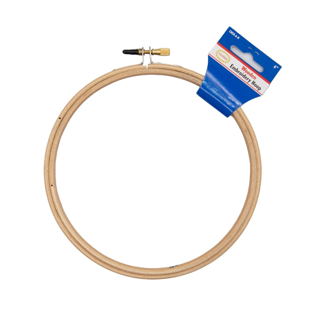 Wooden embroidery hoop with a blue and white label on a white background